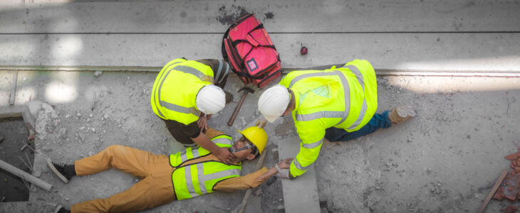 Safety team and engineers help to perform first aid