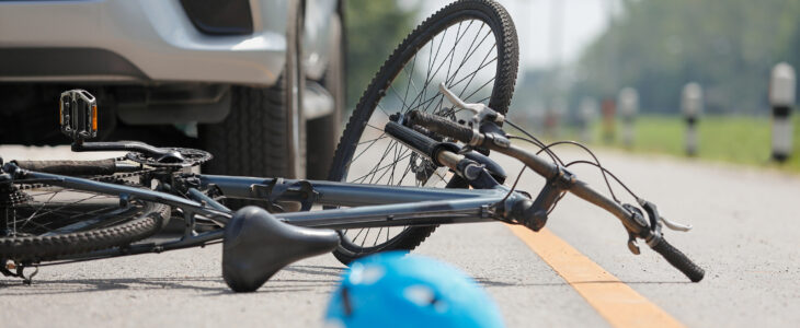 Accident car crash with bicycle on road