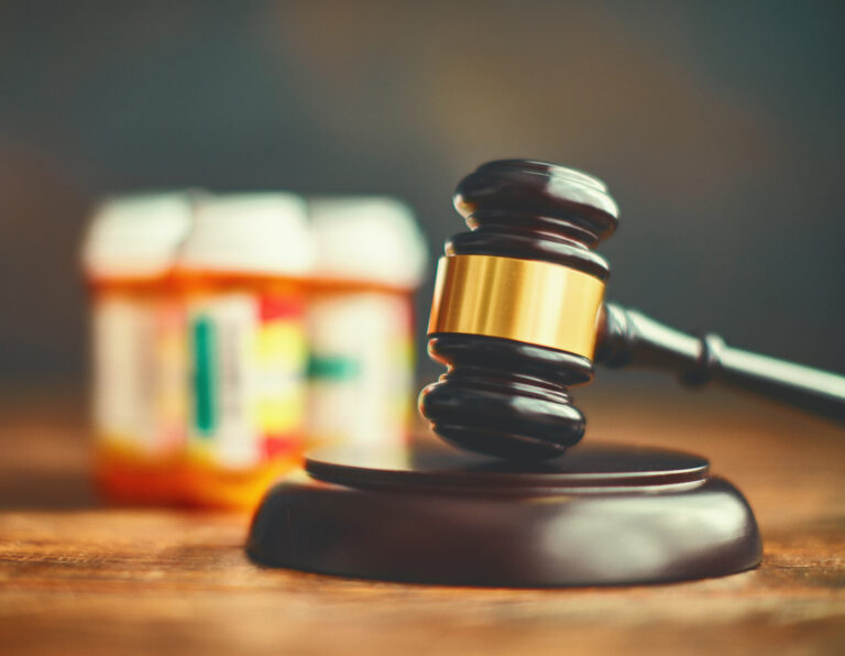 Judge's gavel with medications. Medical malpractice