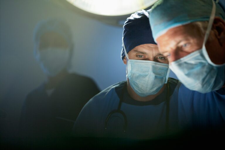 two doctors with surgical masks in a hospital